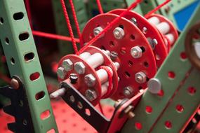 Close-up of the colorful, shiny excavators on the metal construction