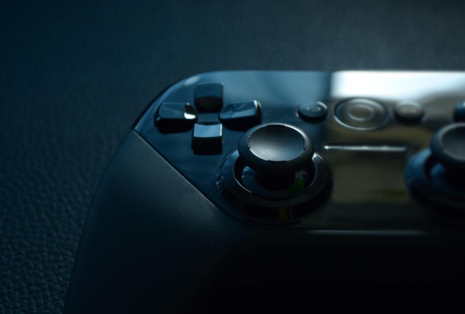 photo of black game controller