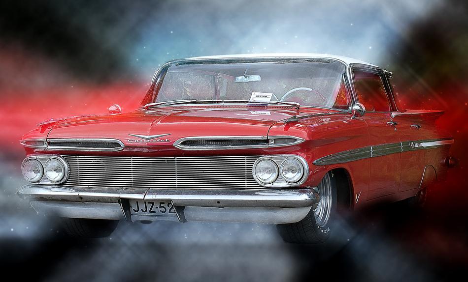 old red car in blurred background
