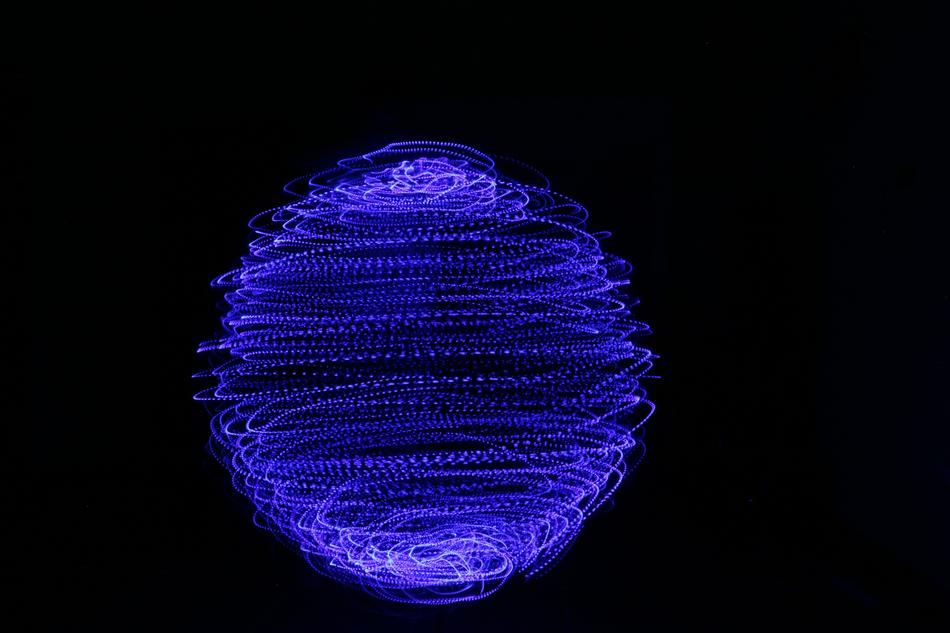 painted blue sphere on a black background