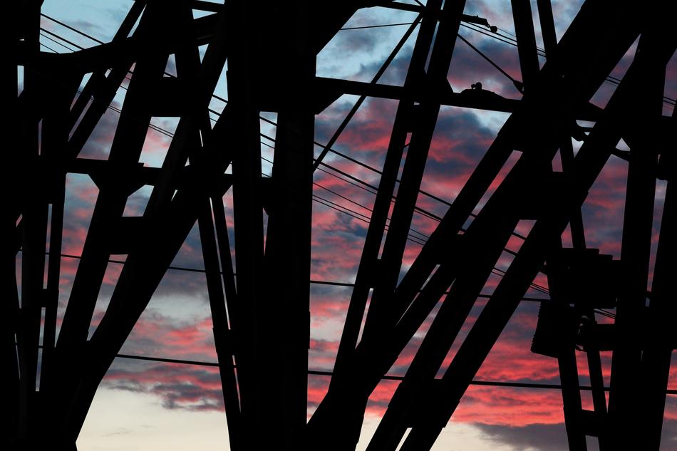 crane structure with purple pink clouds