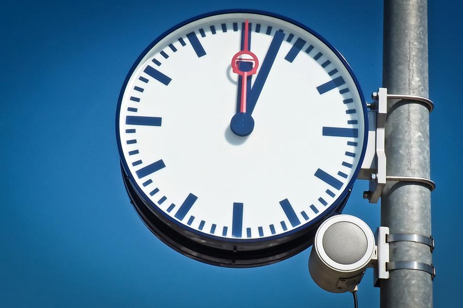 Clock Face Pointer against the sky