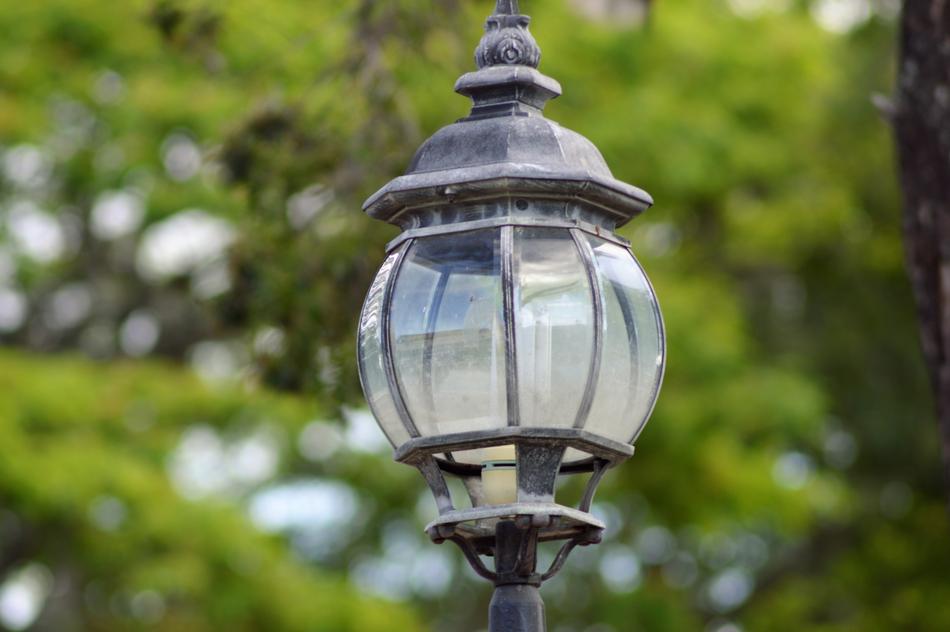 Beautiful incandescent lamp among the green trees in the beautiful park