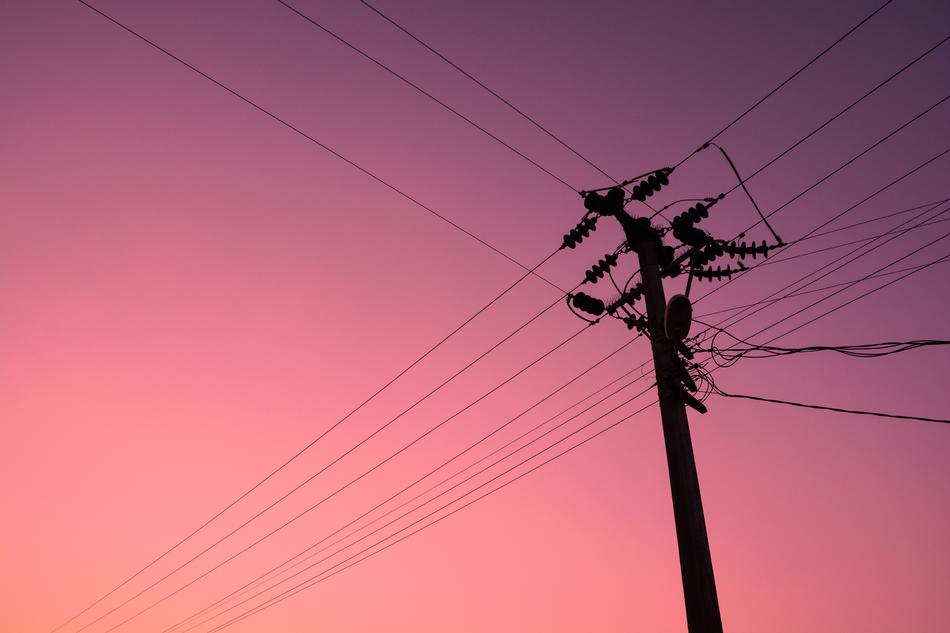 pink sky above the electric pillar