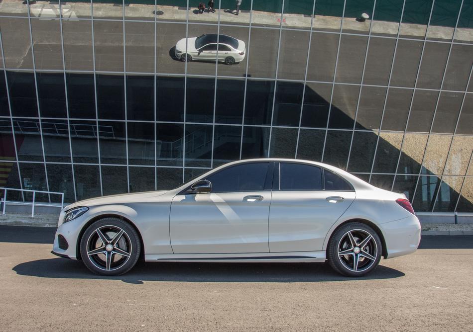 Mercedes Car reflected on the facade