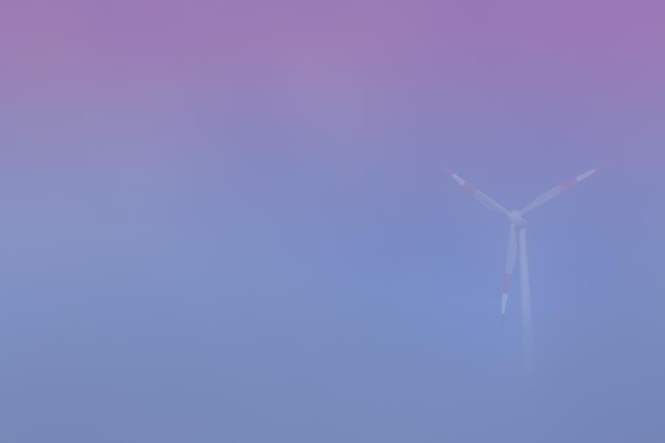 wind turbine in pink blue fog