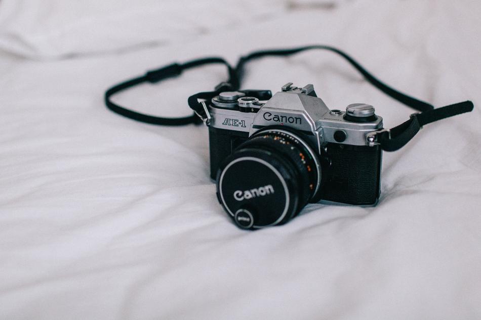 Canon professional camera on white surface