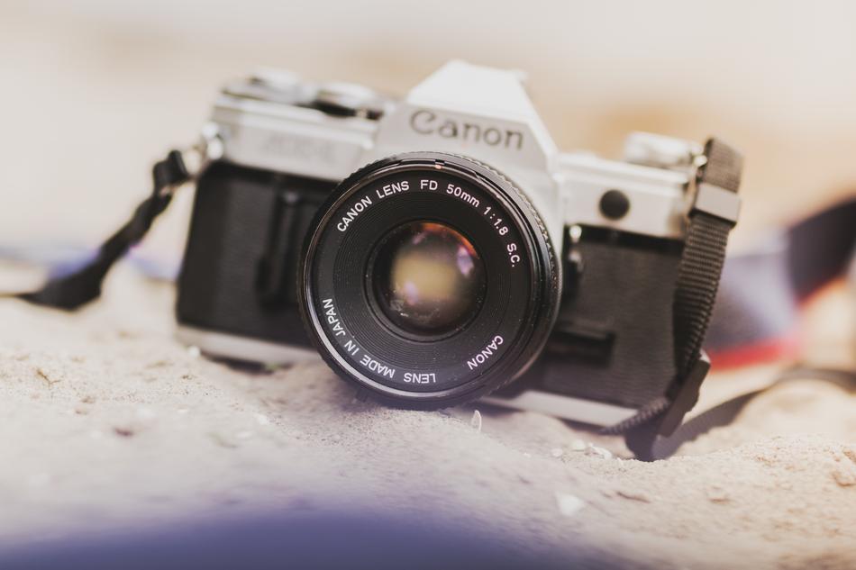 canon camera on sand