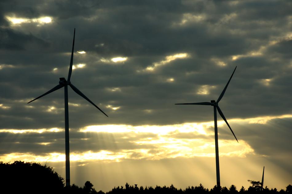 windmills on a cloudy sky background