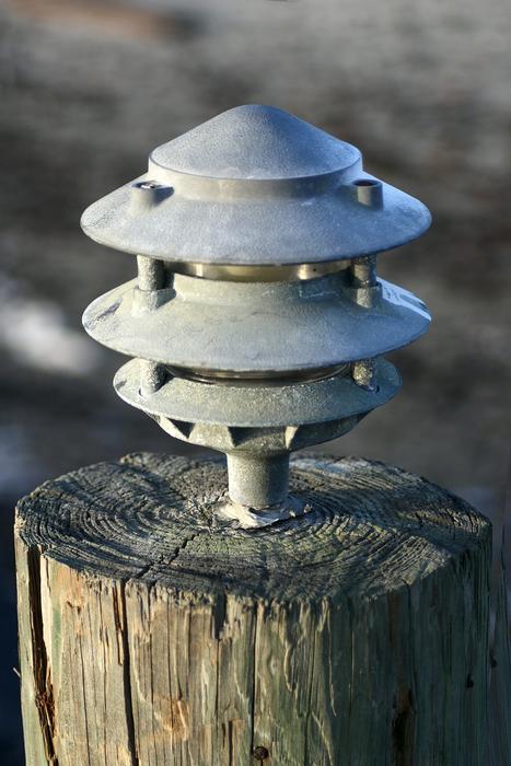Close-up of the shiny beach light on the wood, in light