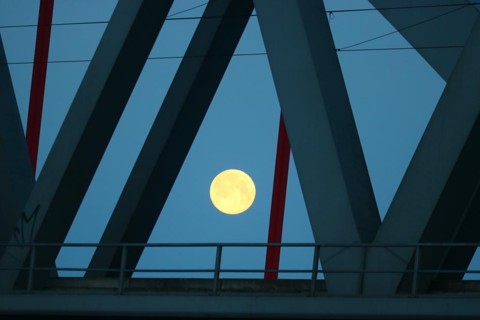 white moon over the railway bridge