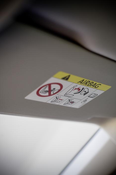 Airbag sign in the auto in light and shadow