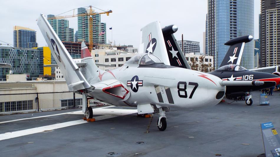 two landed navy Jets in view of city