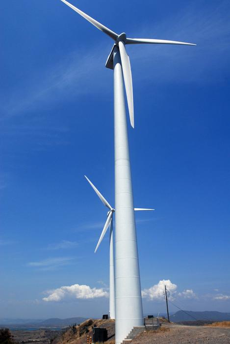 Wind Turbines Sky Clouds on a clear sunny day