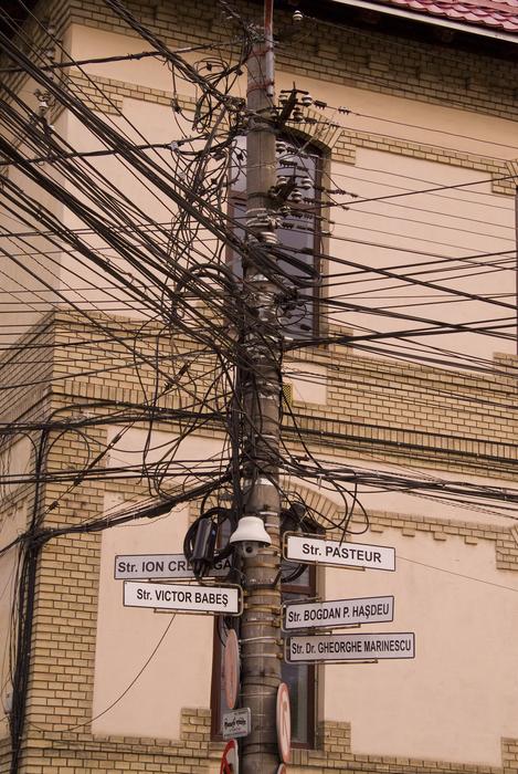 Close-up of the electronic wires on the street, near the building in Cluj Napoca, Romania
