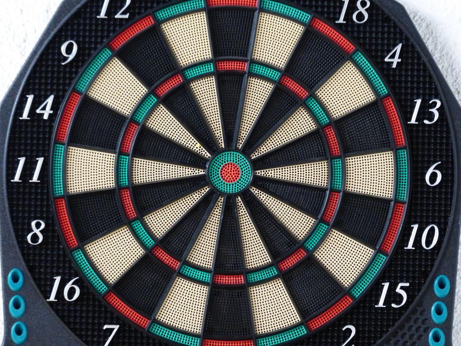 Close-up of the colorful dart board, with the shapes and numbers