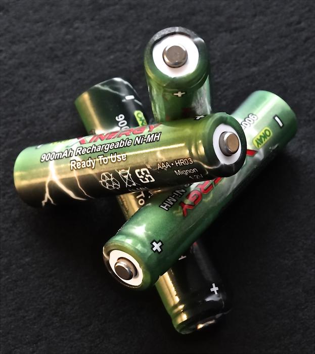 green batteries on a dark background
