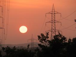 electric towers at sunset in shimoga, karnataka, india