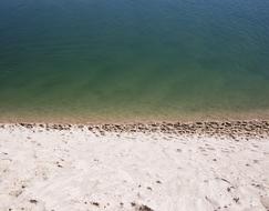sand and green sea water