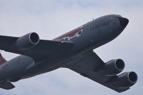 Flying "Kr-135R" stratotanker, under the blue sky with clouds