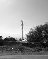 distant view of cable tower in black and white background
