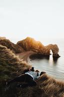 people rest on the beach near the sea