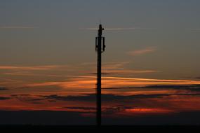Close-up of the pole, at colorful and beautiful sunset with clouds