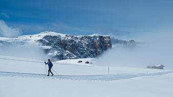 cross-country skiing in the mountains on a sunny day