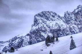 Snowy Alpine Mountains at cloudy day