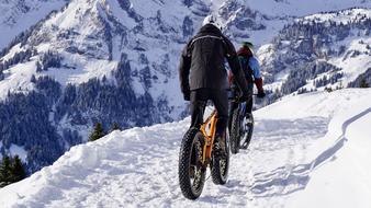 bikers on a snowy mountains