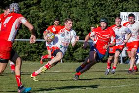 Rugby Sport Players on a field on a sunny day
