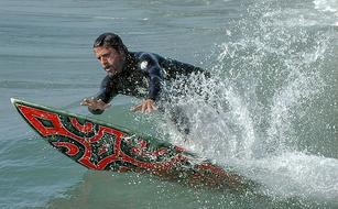 splashing water from a surfer jump off the coast of Hawaii