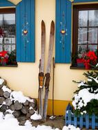 old skis stand at the front of the building