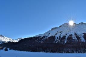 panorama of dawn over a snowy mountain in St. Moritz, Switzerland