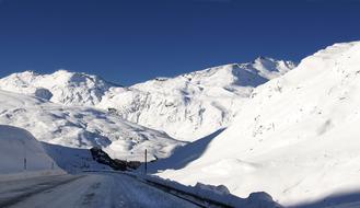photo of a snowy alpine road in Switzerland