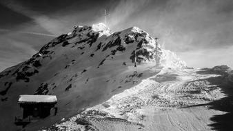 monochrome photo of the top of a snowy mountain in Italy