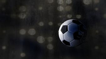 soccer ball on black pixel background