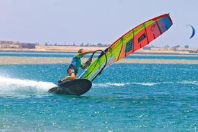 photo of a windsurfer at speed