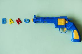 Bang lettering and toy gun