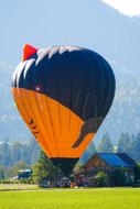 Hot Air Balloon Flying low at scenic mountains