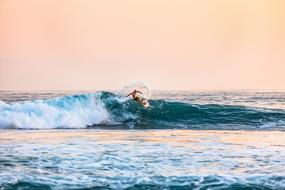 surfer on foamy high wave