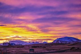 colorful Sunrise sky above small town, Iceland, Hellissandur