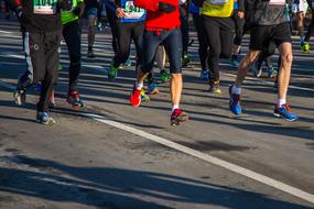 legs of people Running on road