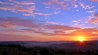 bright sun and pink blue sky at dawn