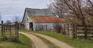 a barn with a rusty roof in the countryside in Ohio