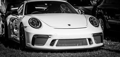 monochrome photo of a white Porsche 911