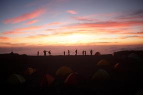 evening photo of climbers at the top of the Yatsugatake Mountains, Japan