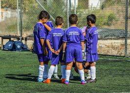 boys playing football