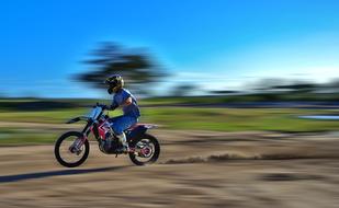 motorcycle rider Speeding on Dirt