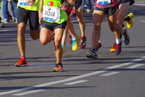 sprinters feet on the marathon track